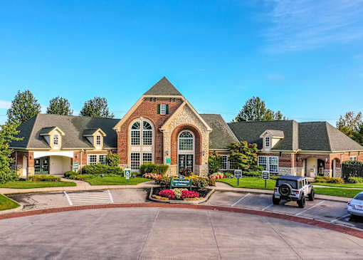 A large, well-maintained building with a driveway in front at Twin Fountains Apartments, Mason, 45040