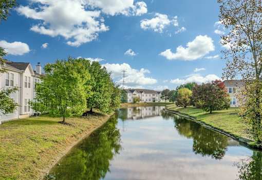 A serene canal with houses at Twin Fountains Apartments, Mason, 45040