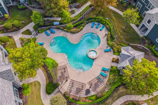 Overhead view of a swimming pool and a resort style pool at Riachi at One21, Plano, TX, Texas
