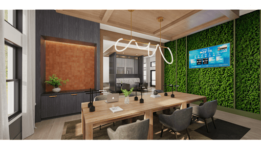 A modern office space with a green wall and a wooden table.