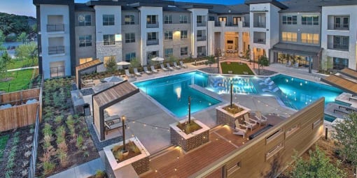 an aerial view of an apartment complex with a pool at Hunters Creek Apartments, Denton, TX 76210