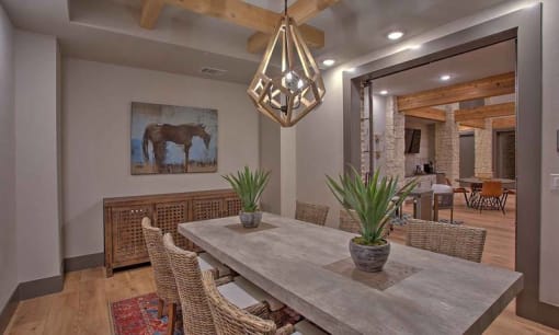 a dining room with a table and chairs at Hunters Creek Apartments, Denton, 76210