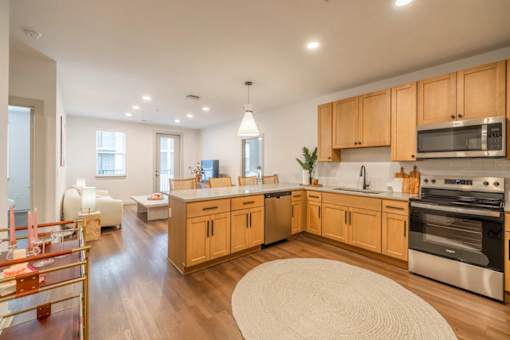 A kitchen with wooden cabinets and stainless steel appliances.