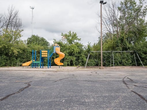 a playground with a slide in a park
