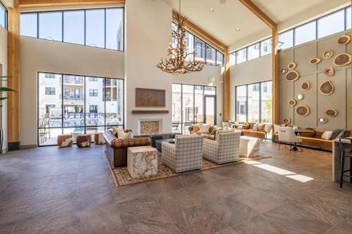 Spacious clubhouse lounge with high ceilings at Timber Club Apartments, St. Peters, Missouri