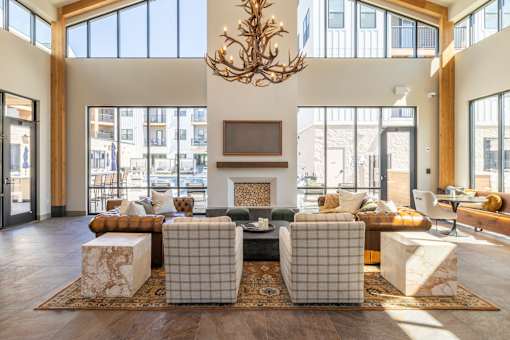 Spacious community clubhouse with antler chandelier at Timber Club Apartments, St. Peters, 63304