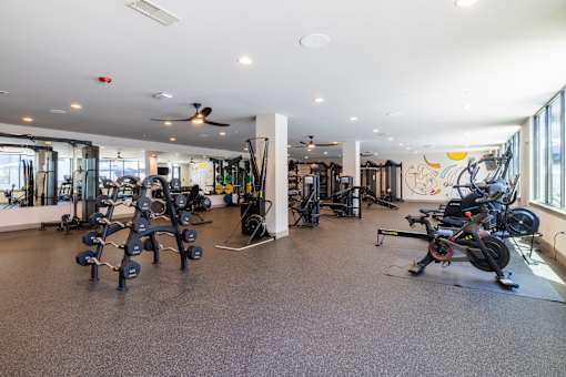 Spacious fitness center with cardio and weight equipment at Timber Club Apartments, St. Peters