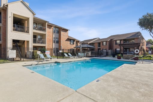 the swimming pool at our apartments at Wellington at Willow Bend Apartments, Plano