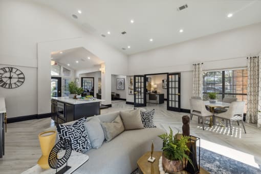 a living room with a couch and a table at Wellington at Willow Bend Apartments, Texas