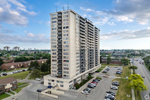an aerial view of a tall building in a city