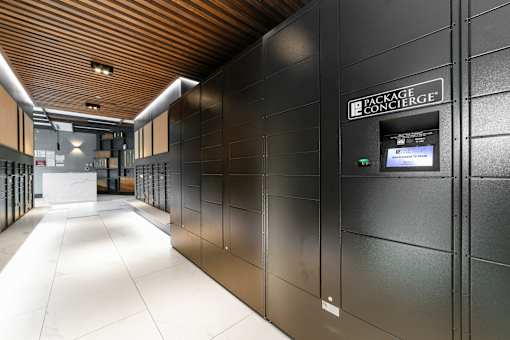 A long hallway with a sign that says Package Concierge.