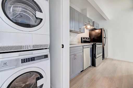 a laundry room with a washer and a dryer in it