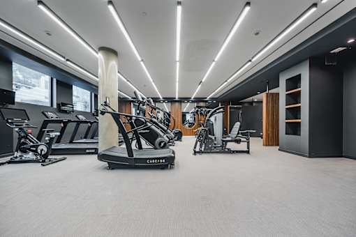 Spacious gym with cardio and strength training equipment at 260 Gold Apartments, Brooklyn, New York