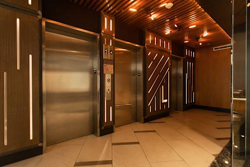 Modern elevator lobby with wood ceiling accents at 1134 Fulton Street Apartments, New York, 11216