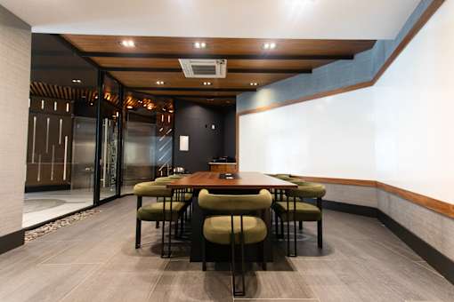 Private dining room with wood table and upholstered chairs at 1134 Fulton Street Apartments, Brooklyn, NY