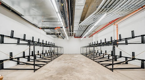Bike storage room with wall mounted racks at 260 Gold Apartments, New York