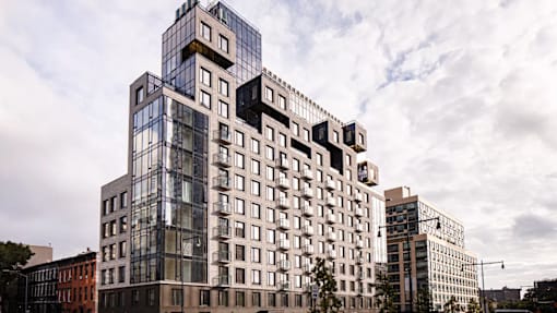 Modern apartment building exterior with geometric architecture at 260 Gold Apartments, Brooklyn, New York