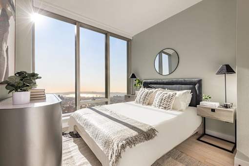 a bedroom with a large window and a bed at The Paxton, Brooklyn, NY 11201