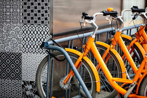 a row of bikes parked next to a window at The Paxton, Brooklyn