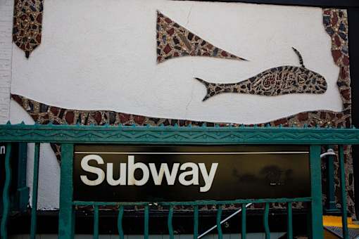 a sign for a subway store with fish on it at The Paxton, Brooklyn