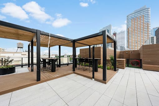 Rooftop terrace with pergola and city skyline views at 260 Gold Apartments, Brooklyn, New York