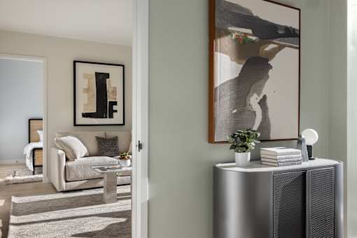 a living room with a couch and a table and a radiator at The Paxton, Brooklyn, New York