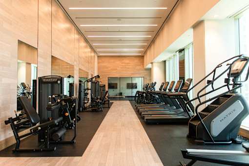 A gym with treadmills and exercise equipment.