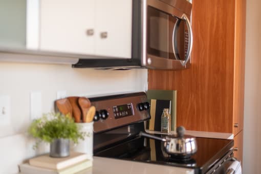 a kitchen with a stove and a microwave