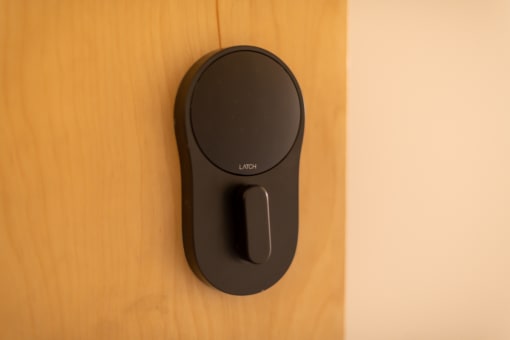 a wireless mouse plugged into a wooden door