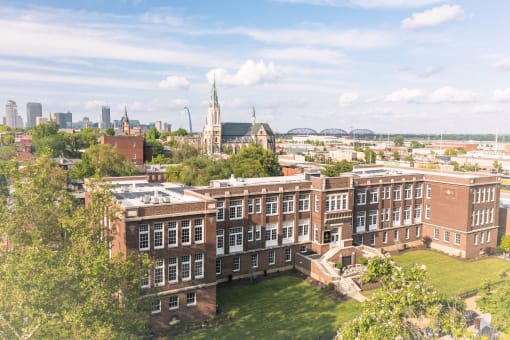 an aerial view of the physics building and the city