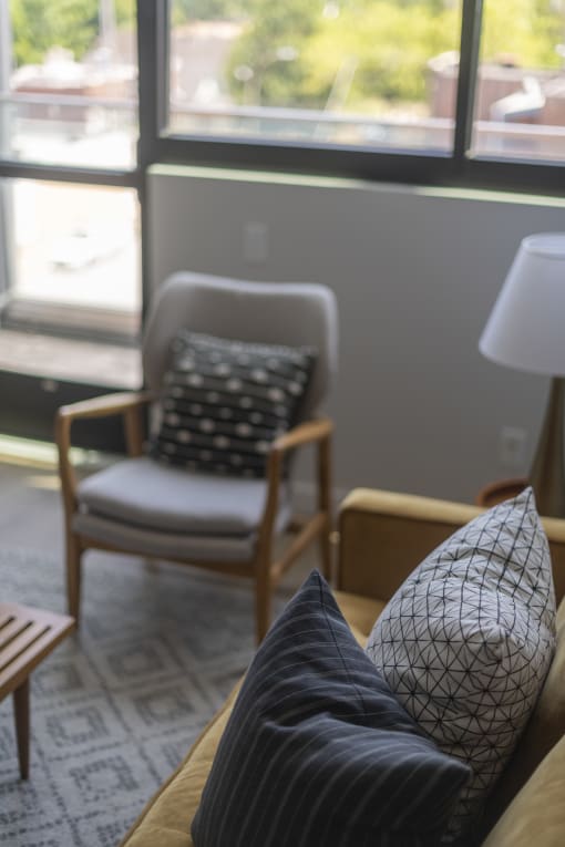 a living room with a couch and two chairs