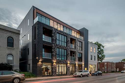 a large building on a city street with cars