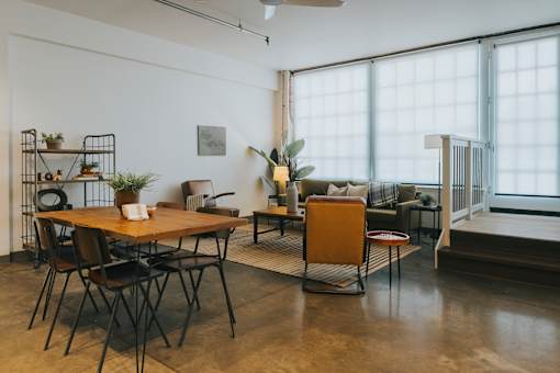 A room with a table and chairs in it.