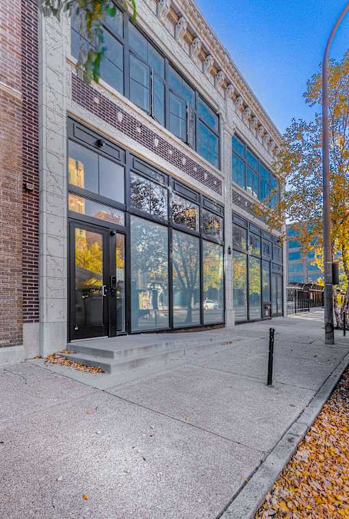 A building with a brick facade and large windows.