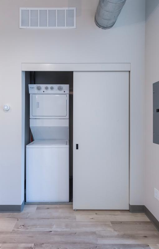 A white oven and fridge are in a small kitchen.