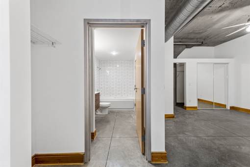 A white bathroom with a toilet and sink.