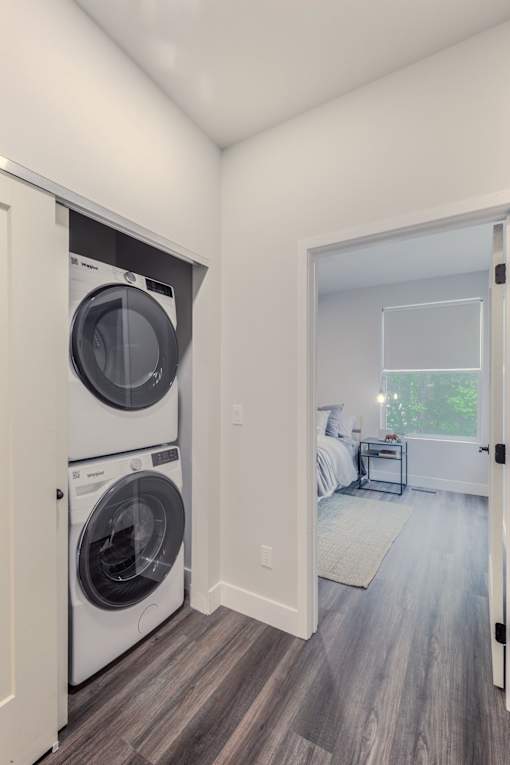 A laundry room with a washer and dryer in it.