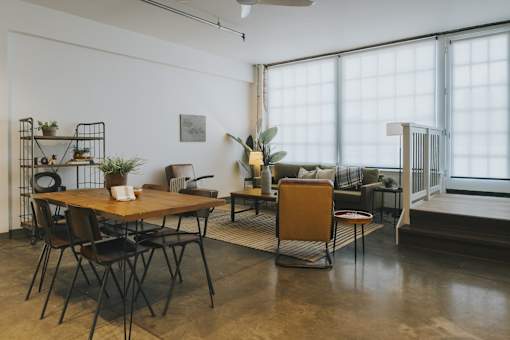 A room with a table and chairs in it.