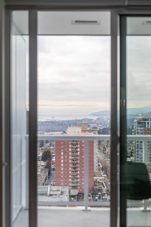 A view of a cityscape through a window.
