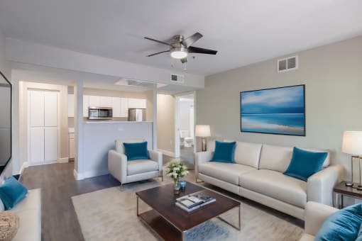 a living room with couches and a coffee table