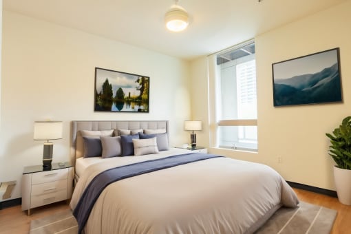 a bedroom with a large bed and a window