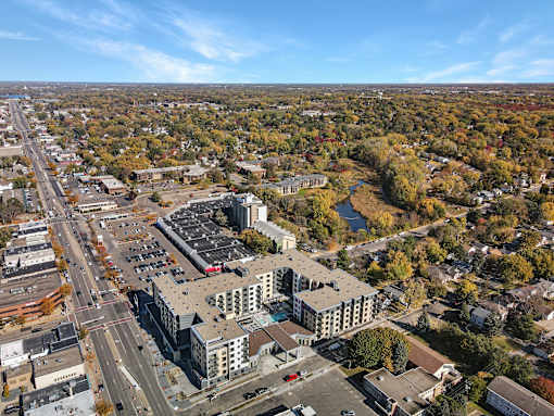 A large building with a parking lot in front of it.