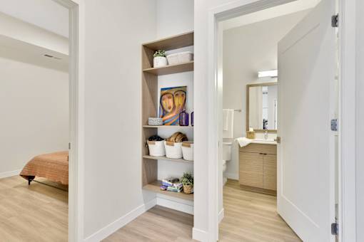 A bathroom with a towel on the floor.