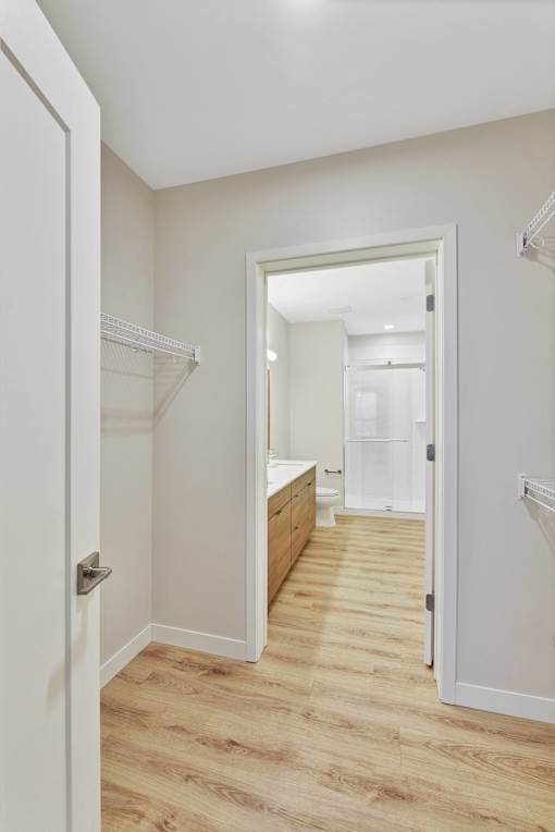 A white door is open to a bathroom.