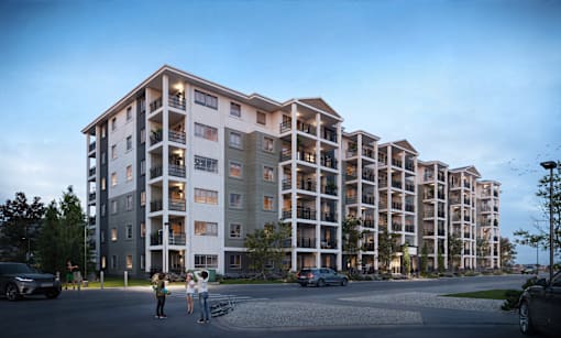A modern apartment complex with multiple balconies and a few people standing outside.