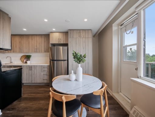 a kitchen and dining area in a 555 waverly unit