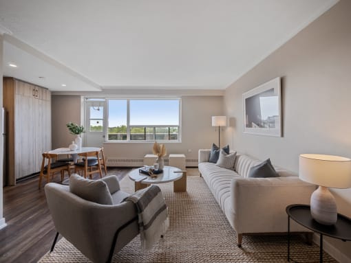 a living room with a couch and two chairs