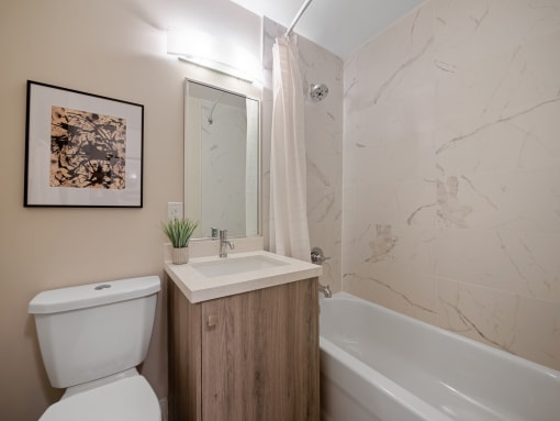 a bathroom with a sink toilet and bathtub