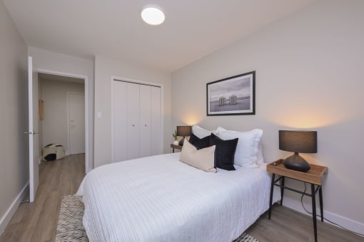 a bedroom with a large bed in a room