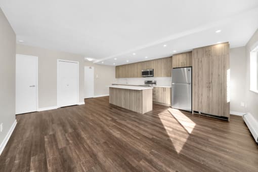 a kitchen and dining area in a 555 waverly unit